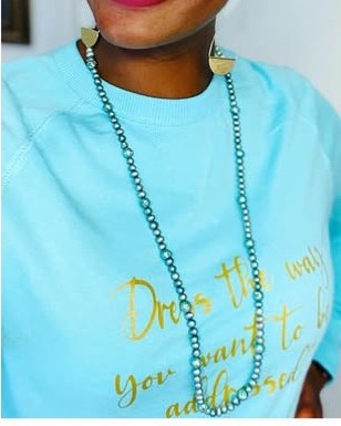 Sky blue crewneck sweatshirt with the gold script line